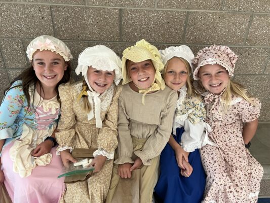 girls in their colonial clothing